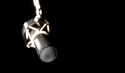 black microphone on a black background close-up
