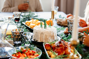 Christmas white cake on a table with pine branches