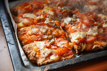 homemade pizza on a baking sheet, disposable tableware, concept zero plastic