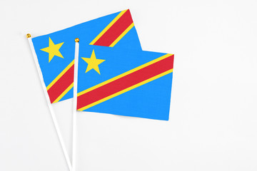 Congo and Congo stick flags on white background. High quality fabric, miniature national flag. Peaceful global concept.White floor for copy space.