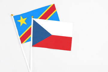 Czech Republic and Congo stick flags on white background. High quality fabric, miniature national flag. Peaceful global concept.White floor for copy space.