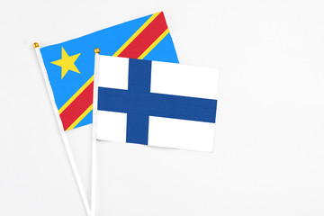 Finland and Congo stick flags on white background. High quality fabric, miniature national flag....