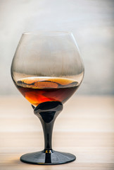 cognac glass sharp wall background 