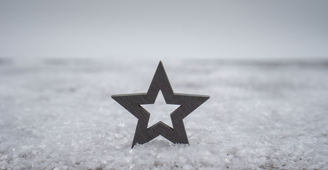 star in snow at christmas time