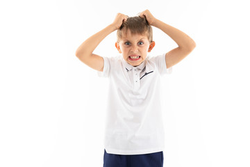 Portrait of a little caucasian boy is angry and screaming