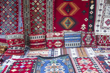 Colorful traditional carpets and pillows in  Albania