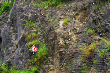 Steel net for protection against rock slide - Metal net background on the mountain wall