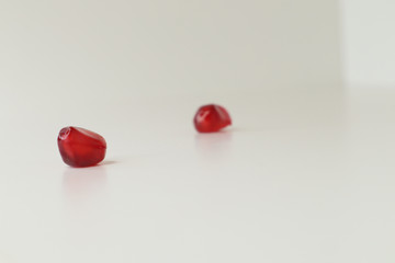  juicy pomegranate on a white background. beautiful contrast. natural color