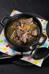 Chicken gizzards stewed with carrot in sauce.