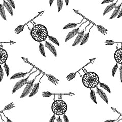 Boho style seamless pattern of dream catchers,  feathers and arrows on white background.