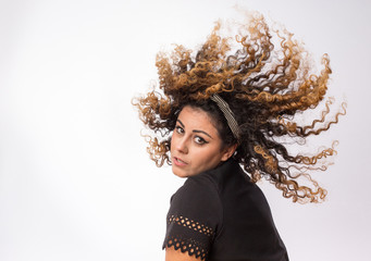 Fototapeta premium Woman moving curly hair