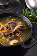 Chicken gizzards stewed with carrot in sauce.
