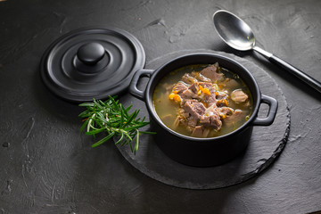 Chicken gizzards stewed with carrot in sauce.