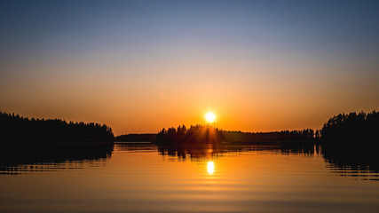 Sunset over lake in summer