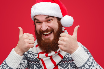 Smiling bearded guy gesturing thumbs up