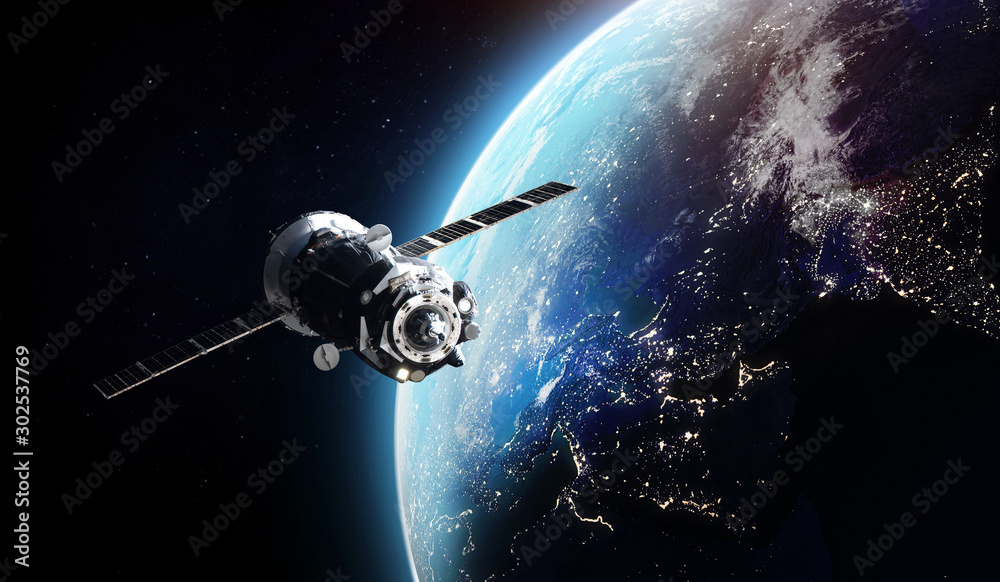 Wall mural Cargo spaceship on orbit of the Earth planet. Dark space. Elements of this image furnished by NASA