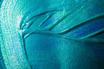 Macro photo. Paint of aquamarine shades close up. Abstract bright image of acrylic paint. The...