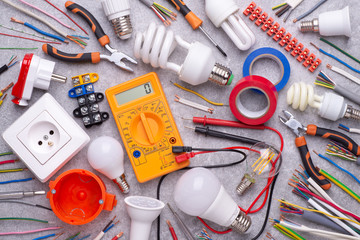 Electrician equipment on silver, metalic background, top view	