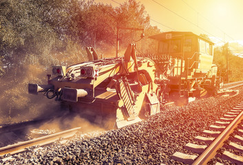 Heavy machinery repairs rail lines