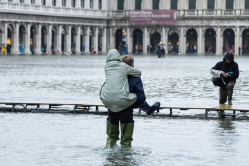 VENICE, ITALY - November 12, 2019: St. Marks Square (Piazza San Marco) during flood (acqua alta) in...