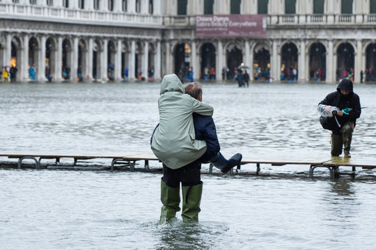 VENICE, ITALY - November 12, 2019: St. Marks Square (Piazza San Marco) during flood (acqua alta) in Venice, Italy. Venice high water.