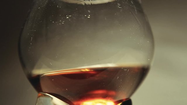 cognac glass sharp wall background hd footage 