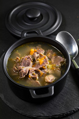 Chicken gizzards stewed with carrot in sauce.