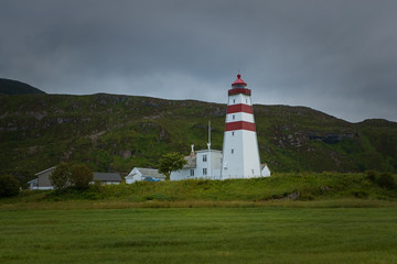 Fototapeta na wymiar The lighthouse of Alnes, Godoy island, on the west coast of Norway. July 2019