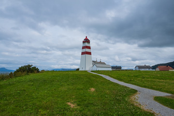 Fototapeta na wymiar The lighthouse of Alnes, Godoy island, on the west coast of Norway. July 2019