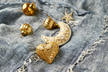 Christmas golden baubles on blue background. Copy space. 