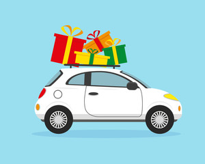 Fototapeta premium White car with Christmas gifts on the roof.