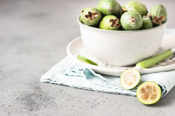 Green feijoa. Berries of the guava family. Tropical fruit. Healthy vegetarian food. Copy space.