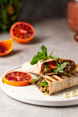 Tortilla wraps sandwiches with fresh vegetables, minced meat and