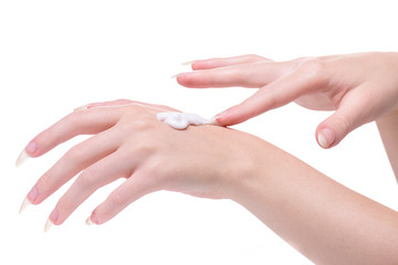 Beautiful hands girl on white background. Beautiful hands of young woman white background. Moisturizer female hand. Apply cream on the skin hands. Applying moisturizer for the hands young girl.