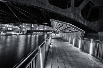 Under a bridge on the Chicago Riverwalk - 302543717