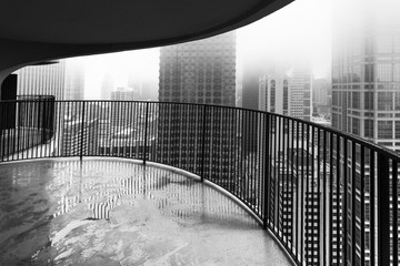Balcony overlooking Chicago buildings in fog - 302543788