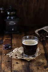 Coffee in glass on a wooden table