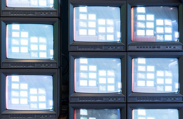 Stack of old analog television monitor with live signal program in broadcasting studio, retro TV tube screen display - obrazy, fototapety, plakaty