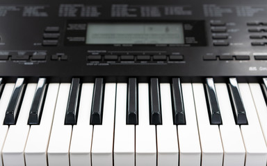 piano keys view from above, electronic midi synthesizer keyboard for creative home studio