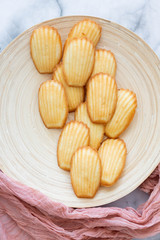 Plate of Madeleines on Marble Background