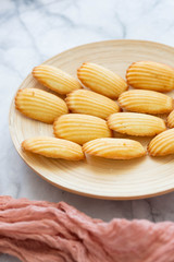 Plate of Madeleines on Marble Background