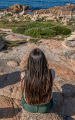 Fototapeta premium brunette girl looking at the sea