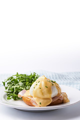 Egg benedict on the plate