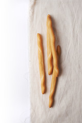 breadsticks on burlap textile