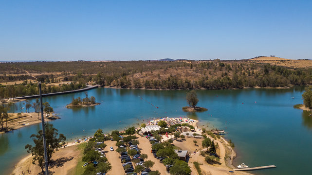 Amazing lake with cristal water surrounded by trees. Mina de S. Domingos, Mertola Alentejo Portugal. drone photo.