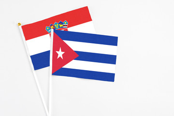 Cuba and Croatia stick flags on white background. High quality fabric, miniature national flag. Peaceful global concept.White floor for copy space.