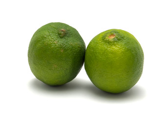 Two limes isolated on white.