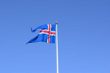 Flying flag of Iceland against clear blue sky