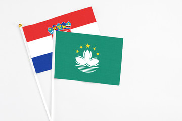 Macao and Croatia stick flags on white background. High quality fabric, miniature national flag. Peaceful global concept.White floor for copy space.