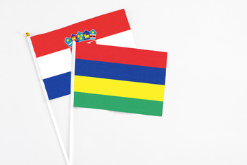 Mauritius and Croatia stick flags on white background. High quality fabric, miniature national flag. Peaceful global concept.White floor for copy space.